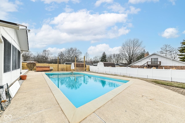 view of pool with a fenced in pool, a fenced backyard, and a patio