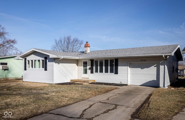 ranch-style house featuring roof with shingles, a chimney, an attached garage, a front yard, and driveway