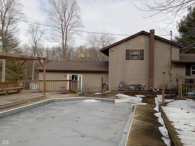 view of home's exterior featuring a wooden deck