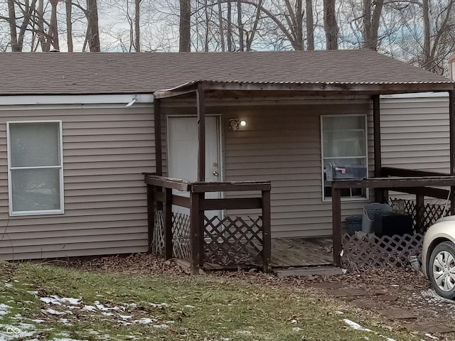 view of home's exterior with roof with shingles