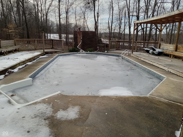 view of swimming pool featuring a wooden deck