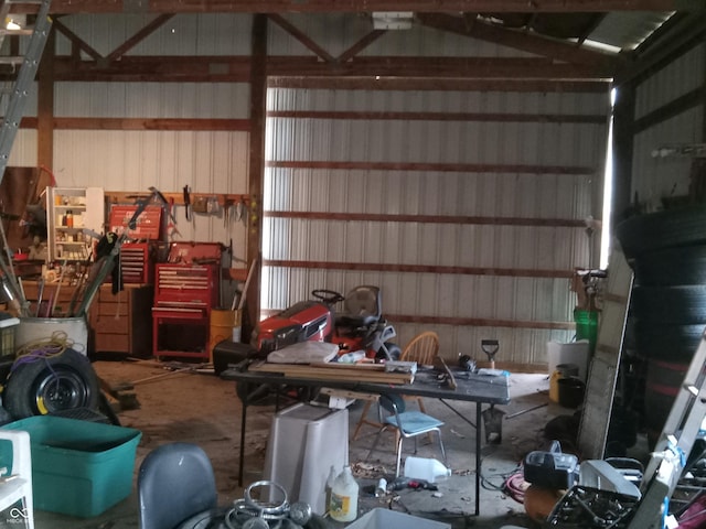 garage featuring metal wall and a workshop area