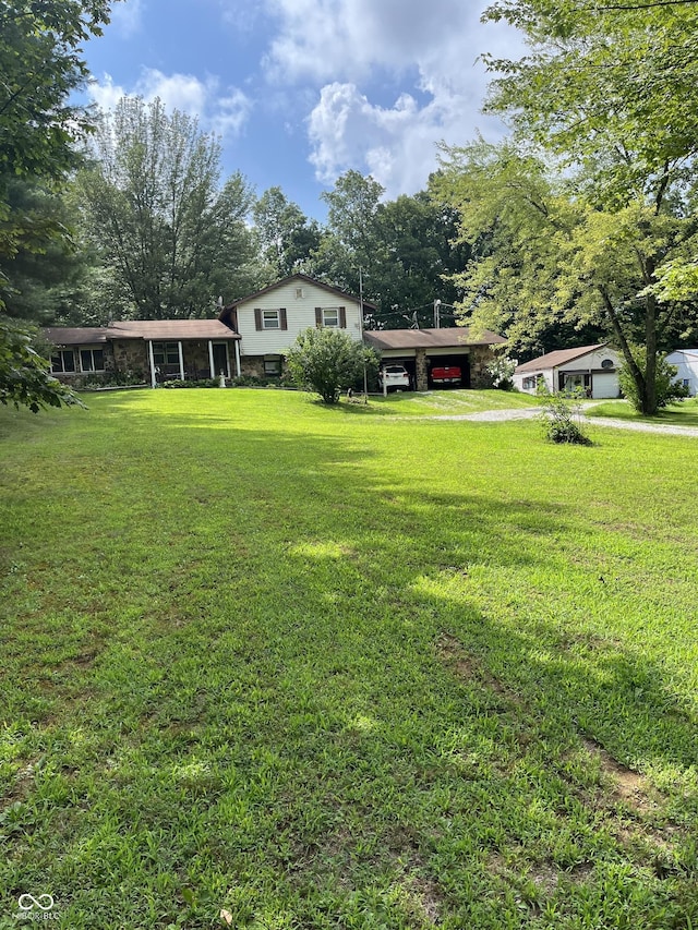 4005 Texas Pike, Spencer, IN 47460 - view of green lawn featuring a carport and driveway