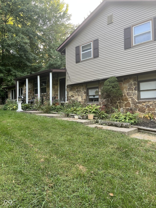 4005 Texas Pike, Spencer, IN 47460 - tri-level home featuring stone siding and a front lawn
