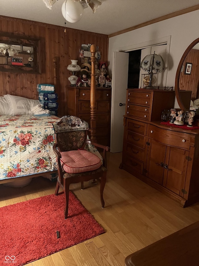 4005 Texas Pike, Spencer, IN 47460 - bedroom with light wood-type flooring, wooden walls, and crown molding