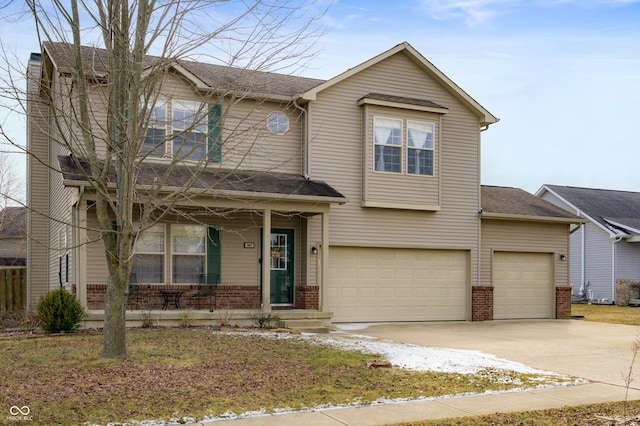 traditional-style home featuring an attached garage, a porch, concrete driveway, and brick siding