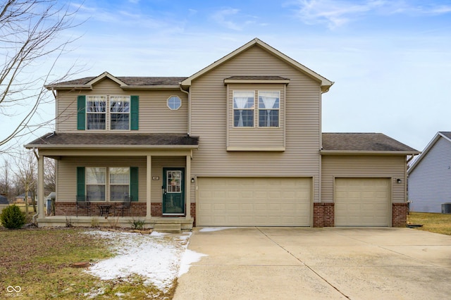 view of front of house featuring covered porch, brick siding, an attached garage, and concrete driveway