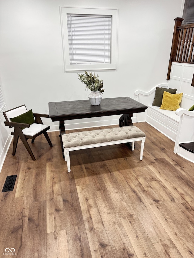 dining room featuring visible vents and wood finished floors