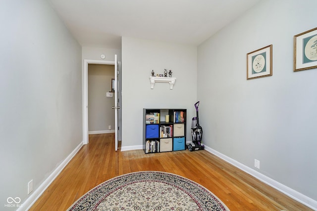 interior space with light wood-style floors and baseboards