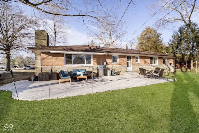 back of house with brick siding, a chimney, outdoor lounge area, a lawn, and a patio area