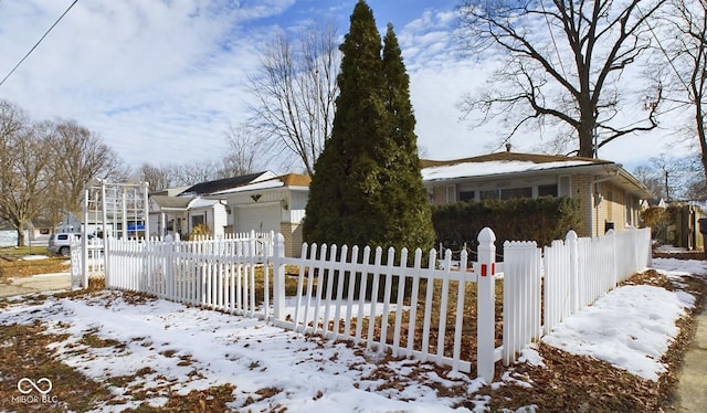 view of front facade with a fenced front yard and an attached garage