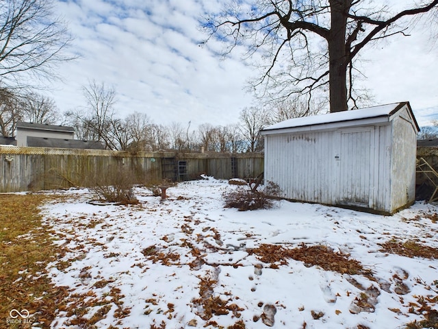 yard covered in snow with fence