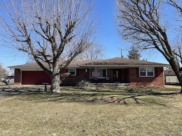 ranch-style home with a front yard, crawl space, brick siding, and an attached garage