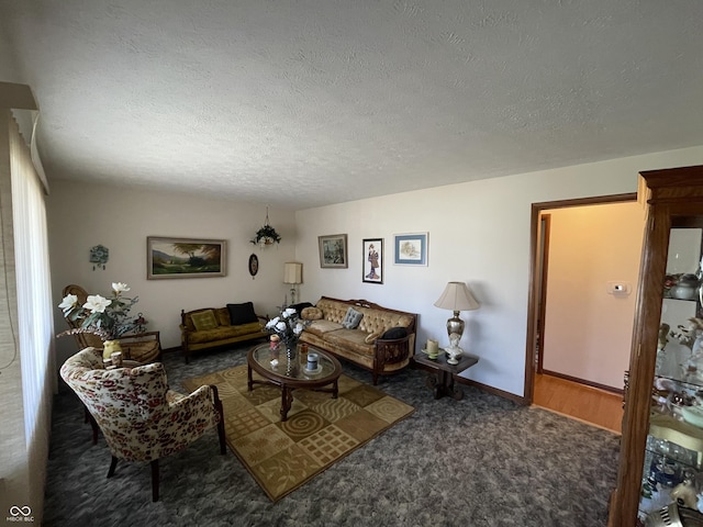 living room featuring baseboards, dark carpet, and a textured ceiling