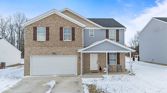 view of front of home featuring concrete driveway, brick siding, and an attached garage