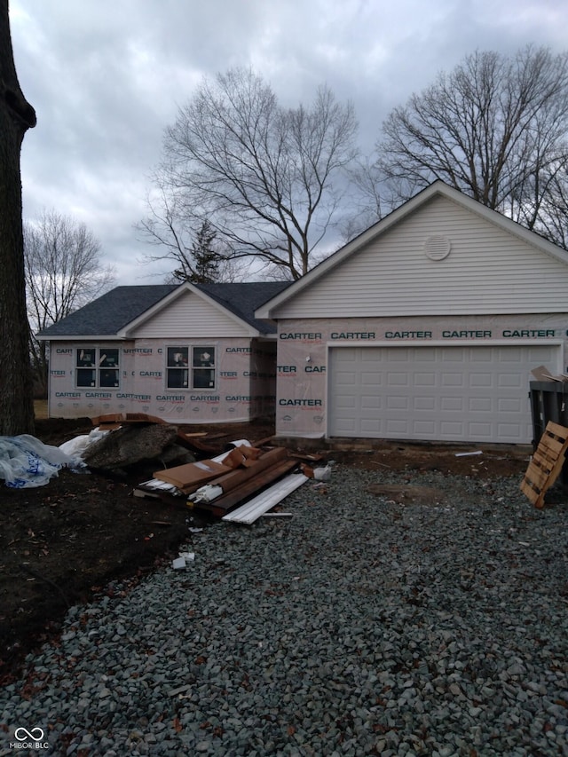 view of front of property featuring an attached garage and driveway