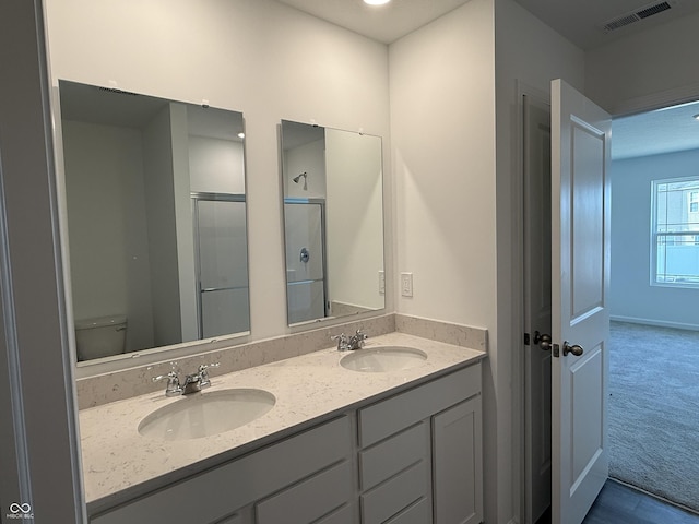 1414 Bluebonnet Pl, Shelbyville, IN 46176 - bathroom with double vanity and a shower with shower door