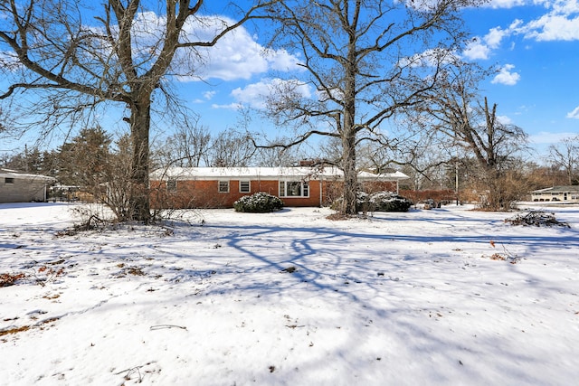 exterior space with brick siding