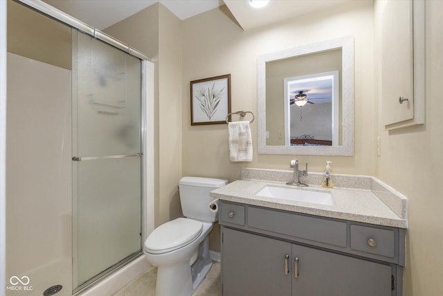 ensuite bathroom with toilet, a stall shower, vanity, and ensuite bathroom