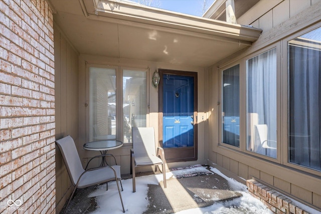 property entrance with brick siding