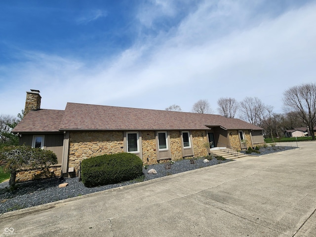 3636 Woodglen Way, Anderson, IN 46011 - ranch-style home with stone siding and a chimney