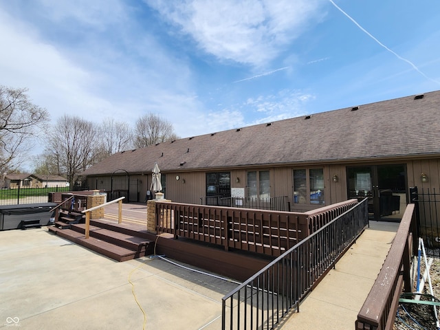 3636 Woodglen Way, Anderson, IN 46011 - rear view of property with a hot tub, roof with shingles, a patio area, fence, and a deck