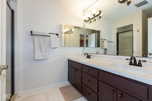 full bathroom with an enclosed shower, a sink, and visible vents