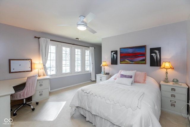 bedroom with baseboards, ceiling fan, visible vents, and light colored carpet