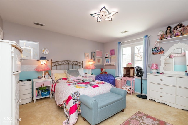 bedroom featuring light carpet and visible vents