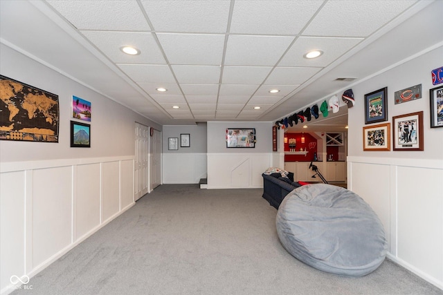 interior space featuring visible vents, a drop ceiling, wainscoting, carpet flooring, and recessed lighting