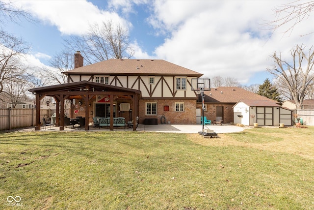 back of house featuring a storage shed, an outdoor structure, fence, a chimney, and a patio area