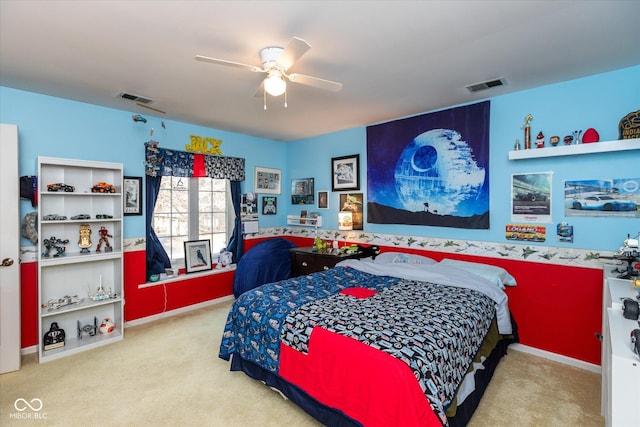 bedroom featuring baseboards, carpet, visible vents, and a ceiling fan