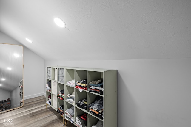 interior space with lofted ceiling and wood finished floors