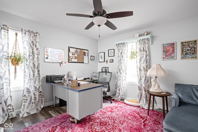 office area with ceiling fan, baseboards, and wood finished floors