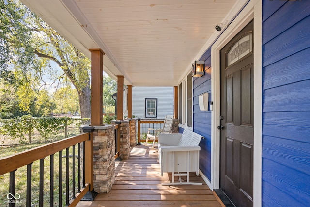 wooden terrace featuring a porch