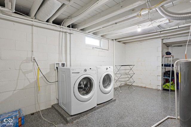 clothes washing area with laundry area and washer and clothes dryer