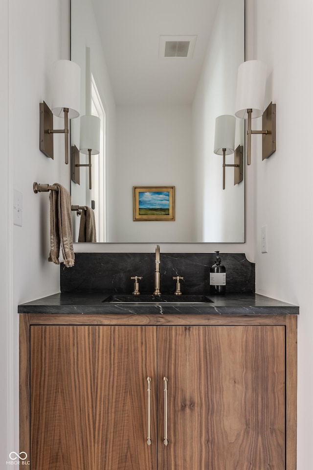 bathroom featuring vanity and visible vents