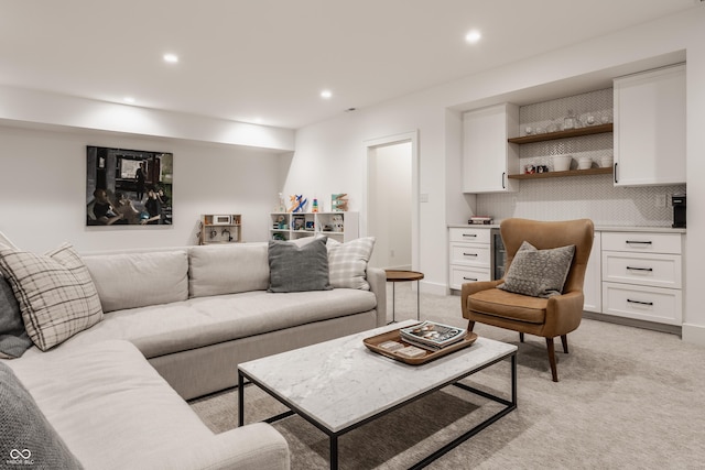 living room featuring light carpet, built in study area, and recessed lighting