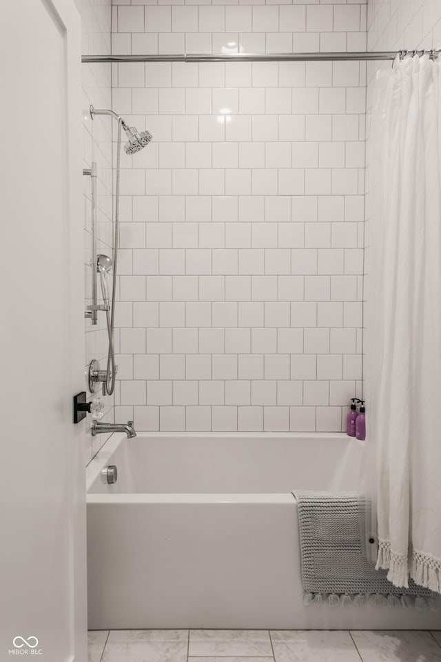 bathroom with shower / bath combination with curtain