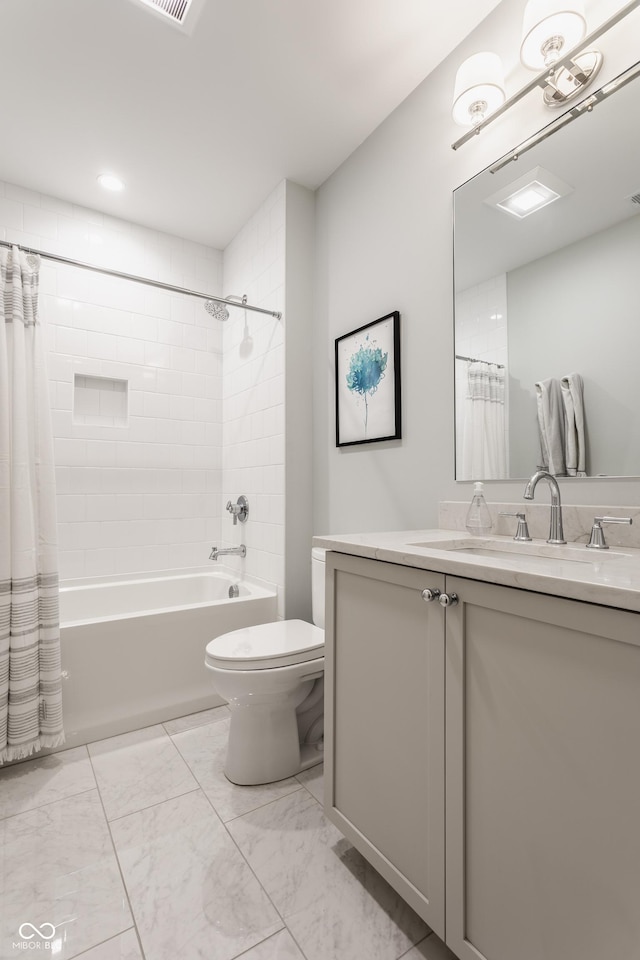 bathroom with marble finish floor, shower / tub combo with curtain, vanity, and toilet