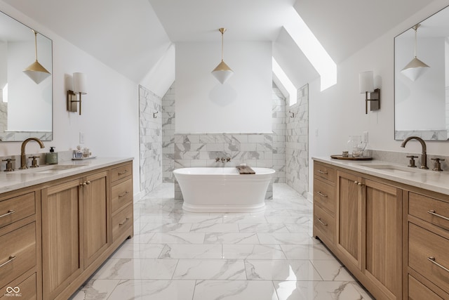 full bath with marble finish floor, two vanities, and a sink