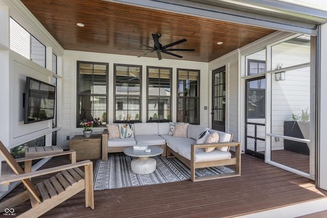 sunroom / solarium featuring wooden ceiling and a ceiling fan