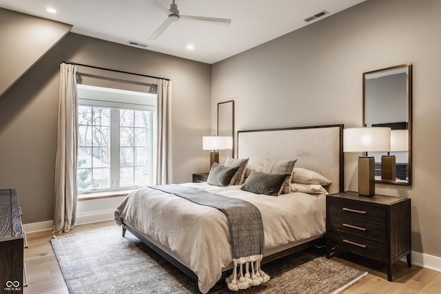 bedroom featuring recessed lighting, light wood-type flooring, visible vents, and baseboards