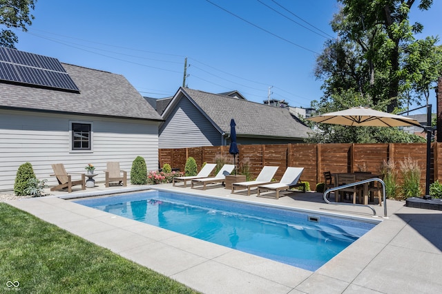 view of pool with a fenced in pool, a patio, and fence