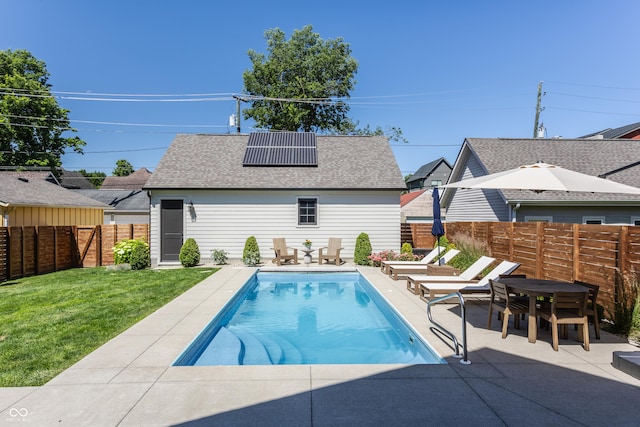 view of swimming pool with a fenced in pool, a lawn, a fenced backyard, outdoor dining area, and a patio area