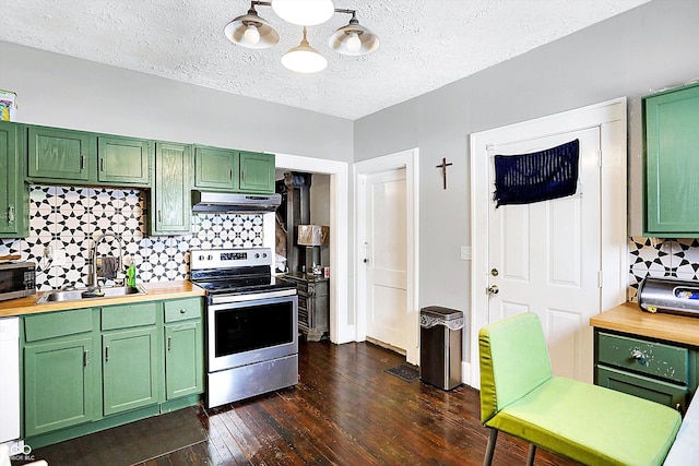 kitchen with stainless steel appliances, green cabinetry, and under cabinet range hood