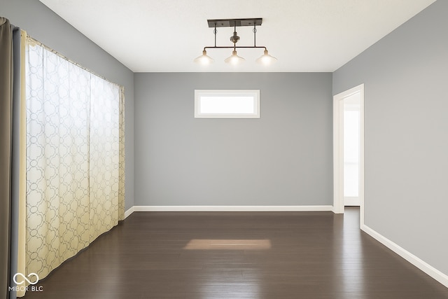 2401 N Olney St, Indianapolis, IN 46218 - unfurnished room featuring dark wood-style flooring and baseboards