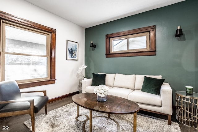 living room featuring wood finished floors and baseboards