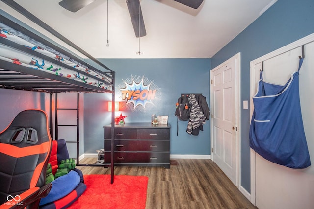 bedroom featuring ceiling fan, wood finished floors, and baseboards