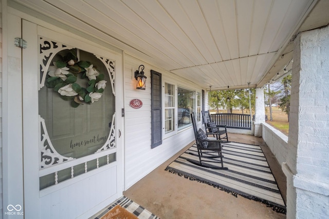 view of patio featuring a porch